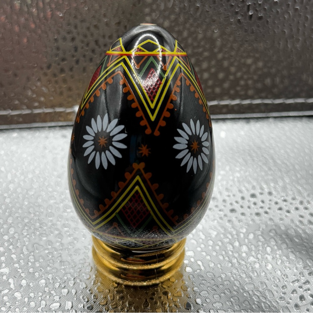 Black egg with geometric pattern and flower multiple colors